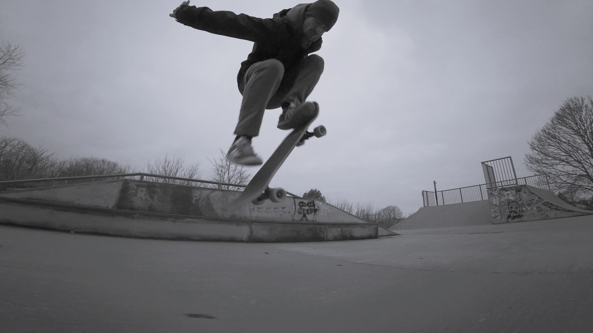 Skater mid-trick at a skatepark